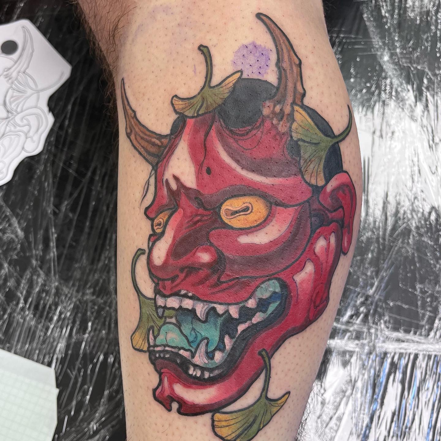Japanese hannya mask tattoo red with golden eyes